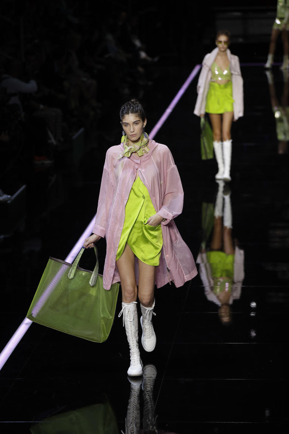 Models wear creations as part of the Emporio Armani women's 2019 Spring-Summer collection, unveiled during the Fashion Week in Milan, Italy, Thursday, Sept. 20, 2018. (AP Photo/Luca Bruno)