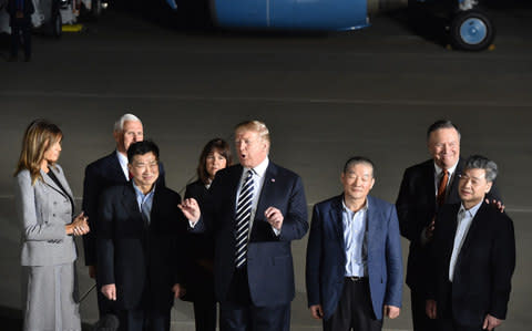 Donald Trump immediately thanked Kim Jong-un, the North Korean leader, for granting freedom to the detainees - Credit: NICHOLAS KAMM/ AFP