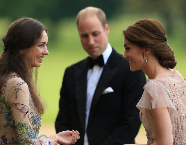 HRH Prince William and Kate Middleton are greeted by Rose Cholmondeley, the Marchioness of Cholmondeley. Photo by Stephen Pond/Getty Images.