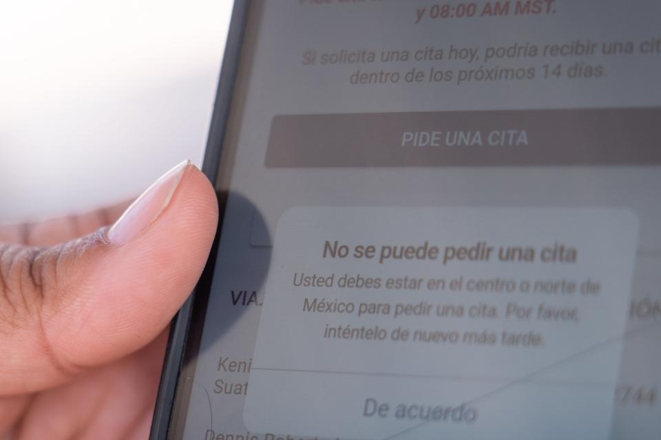 Kenia Jameleth, an asylum seeker from Honduras staying at a migrant shelter in San Luis Rio Colorado, Sonora, Mexico, on May 12, 2023, shows a message she receives when attempting to apply for an appointment using the CBP One app. Despite staying at a shelter on the border in Mexico, the message says she is unable to ask for an appointment because she needs to be in central or northern Mexico to do so.