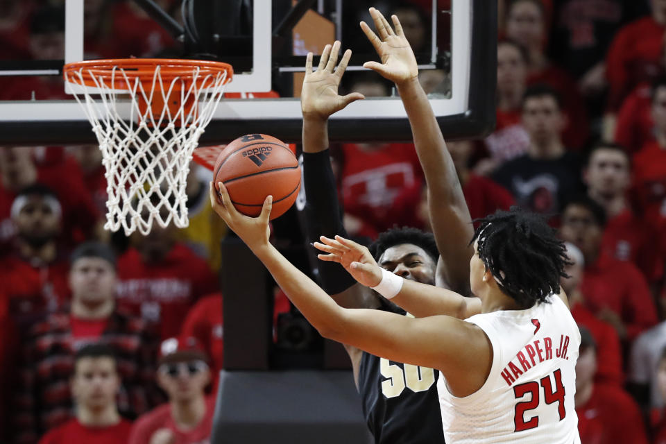 Rutgers guard Ron Harper Jr. (24) shoots around Purdue forward Trevion Williams (50) during the first half of an NCAA college basketball game Tuesday, Jan. 28, 2020, in Piscataway, N.J. (AP Photo/Kathy Willens)