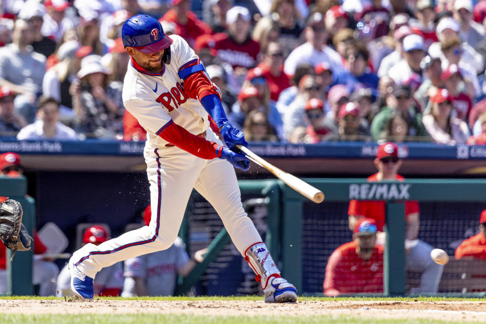 Philadelphia Phillies Edmundo Sosa hits an RBI during the second inning of a baseball game against the Cincinnati Reds, Sunday, April 9, 2023, in Philadelphia. (AP Photo/Laurence Kesterson)