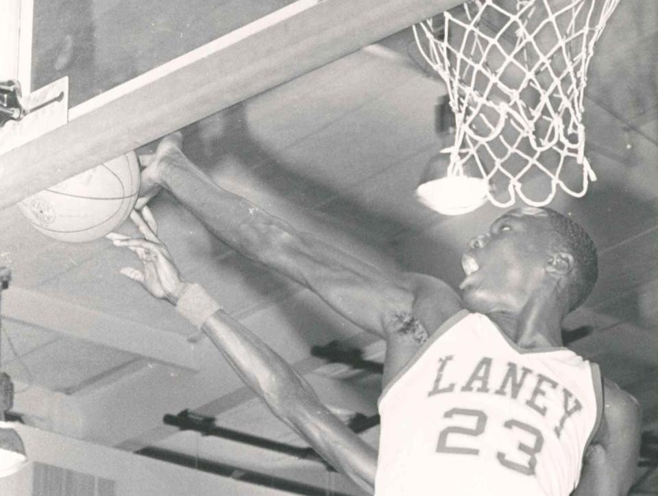 Laney High School's Michael Jordan goes up for the ball in 1980.