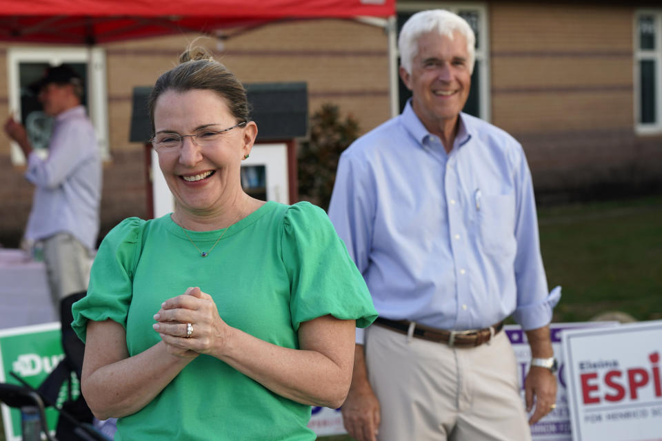 Virginia State Sen. Siobhan Dunnavant, R-Henrico, left, and Republican candidate for the House of Delegates David Owen speak to reporters as they greet voters at a polling station, Tuesday Nov. 7, 2023, in Glenn Allen, Va. (AP Photo/Steve Helber)