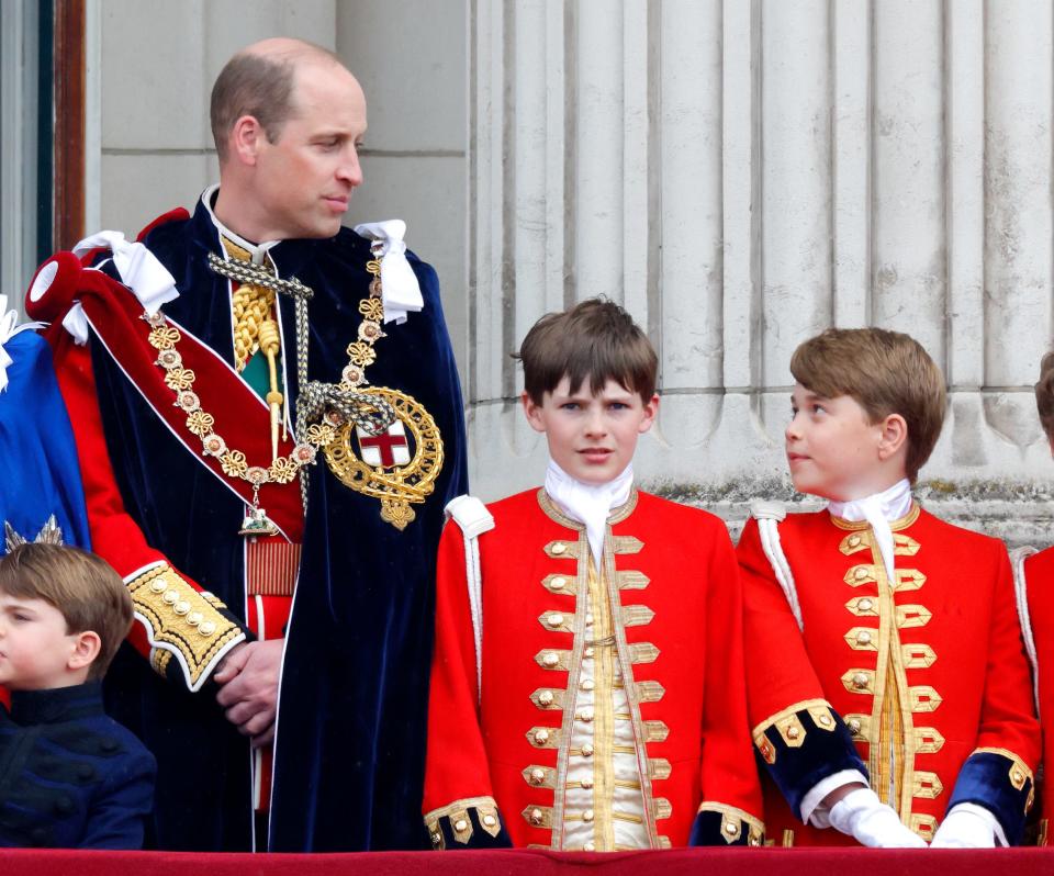 Prince William and Prince George on the balcony of Buckingham Palace following the Coronation of King Charles III & Queen Camilla at Westminster Abbey on May 6, 2023 in London, England.