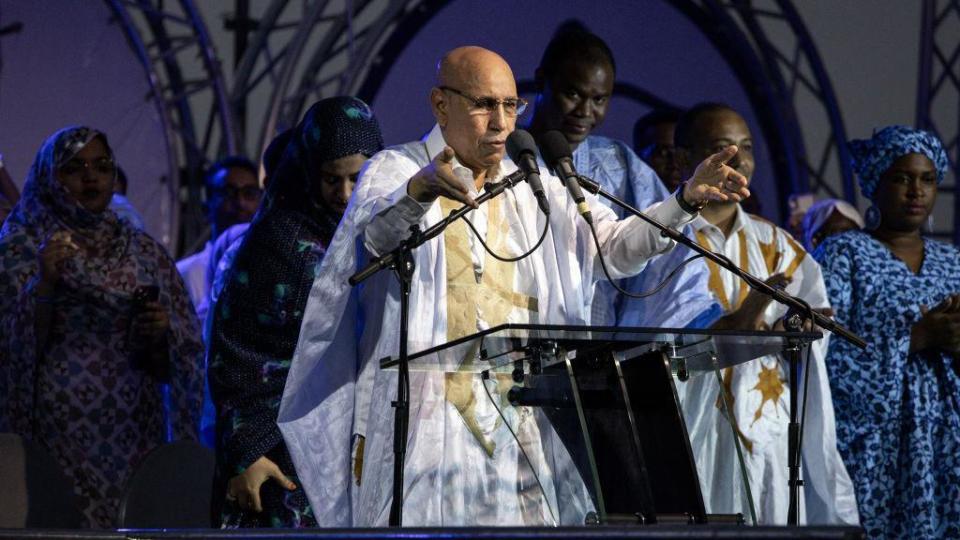 President of Mauritania looks over a crowd at a final rally