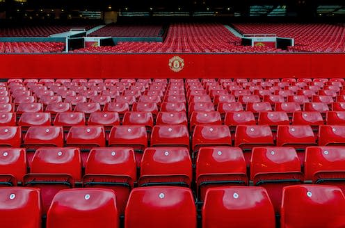 <span class="caption">United fans are calling for a stadium boycott – but the majority live thousands of miles from Old Trafford.</span> <span class="attribution"><a class="link " href="https://www.shutterstock.com/image-photo/manchester-england-old-trafford-stadium-on-634430981" rel="nofollow noopener" target="_blank" data-ylk="slk:warasit phothisuk/Shutterstock;elm:context_link;itc:0;sec:content-canvas">warasit phothisuk/Shutterstock</a></span>