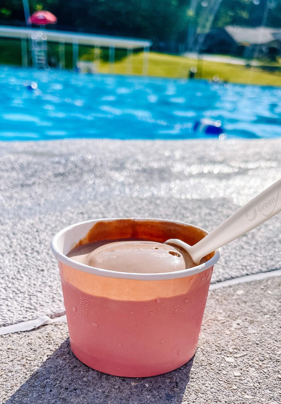 Milk + Honey Ice Cream launched in time for this summer. Chocolate orange flavor ice cream is pictured poolside on May 31, 2022.