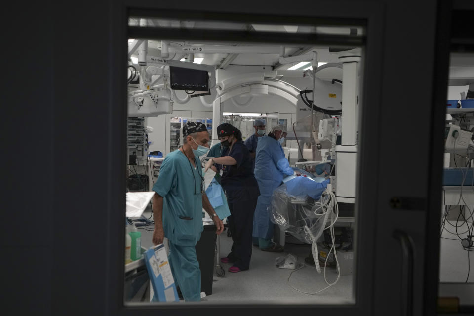Karina Andreiko, a 5-year-old Ukrainian girl, undergoes heart surgery by a team led by Dr. Sagi Assa, head of invasive pediatric cardiology, from the Save A Child's Heart non-profit organization, at the Wolfson Medical center in Holon, near Tel Aviv, Israel, Monday, May 2, 2022. Andreiko, received treatment in Israel for a heart defect that she would not have in her war-ravaged home country. (AP Photo/Ariel Schalit)