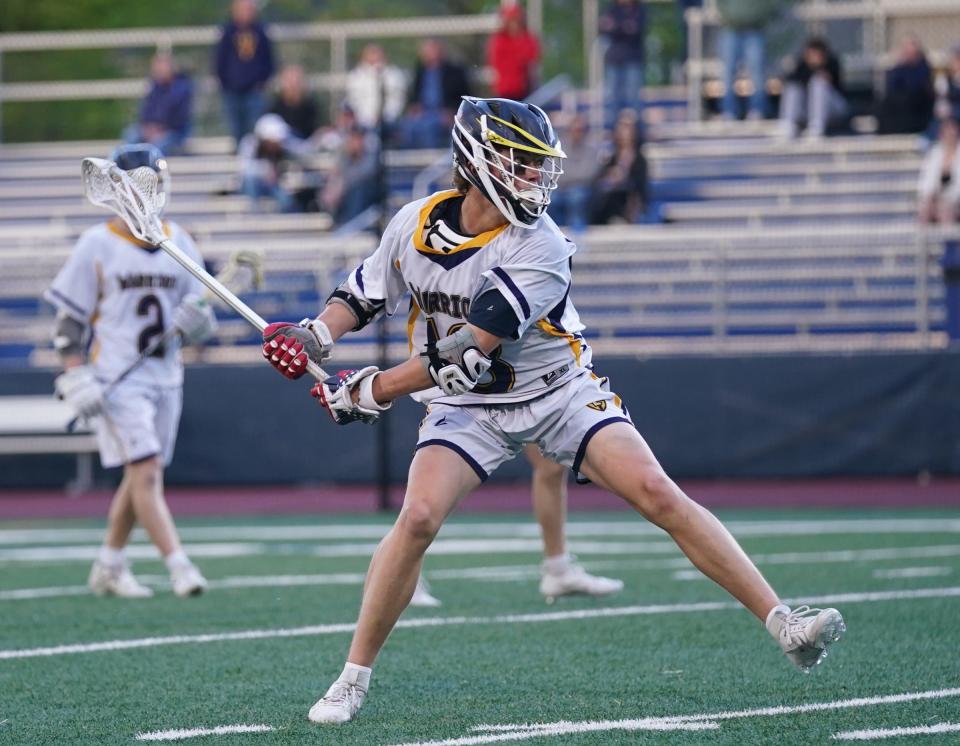 Lourdes' Drew Cornax (18) takes a shot on goal during their 16-15 win over Goshen in boys lacrosse action Our Lady of Lourdes High School in Poughkeepsie on Friday.