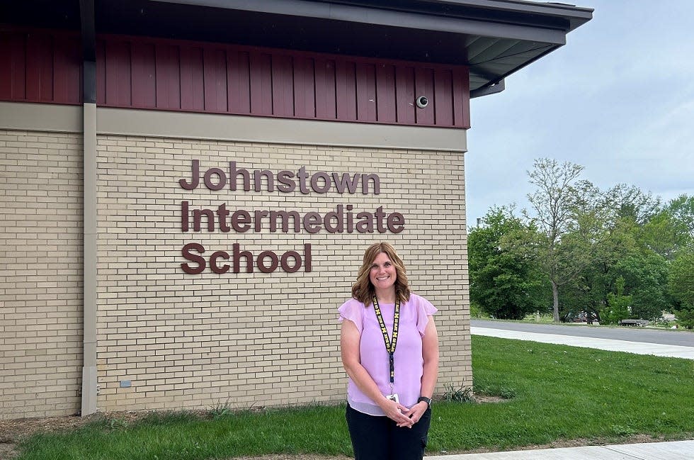 Johnstown Intermediate School Secretary Amy Fauble outside the school on Friday. In her position, Fauble is responsible for ensuring the school runs smoothly day to day.