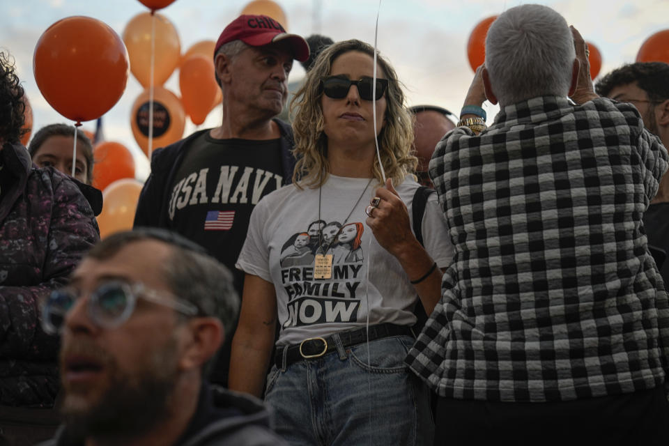 Israeli protesters call for the release of the Bibas family, whose members are being held hostage in the Gaza Strip by the Hamas militant group, in Tel Aviv, Tuesday, Nov. 28, 2023. Hamas has released over 50 Israeli hostages in recent days as part of a cease-fire agreement, but it still holds dozens of others, including the Bibas family. The family's 10-month-old son Kfir is the youngest hostage in Hamas captivity. (AP Photo/Ariel Schalit)