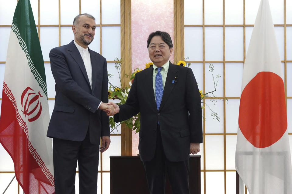 Japanese Foreign Minister Yoshimasa Hayashi, right, and Iranian counterpart Hossein Amir-Abdollahian shake hands before their meeting Monday, Aug. 7, 2023, in Tokyo. (AP Photo/Eugene Hoshiko)