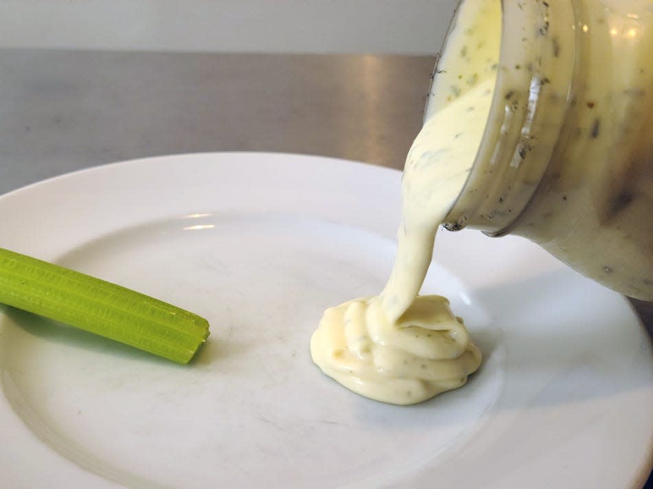 Marie's ranch being poured onto a plate.