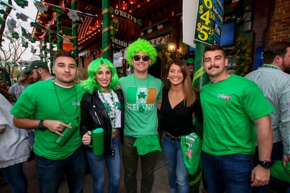 Hundreds of people make their way through downtown Pensacola during O'Riley's Irish Pub's 4th annual Grog March on Saturday, March 16, 2019. The event collected food and cash donations for Manna Food Pantries.