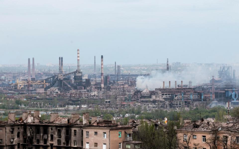 Smoke rises from the steel works in besieged Mariupol on Thursday - AP 