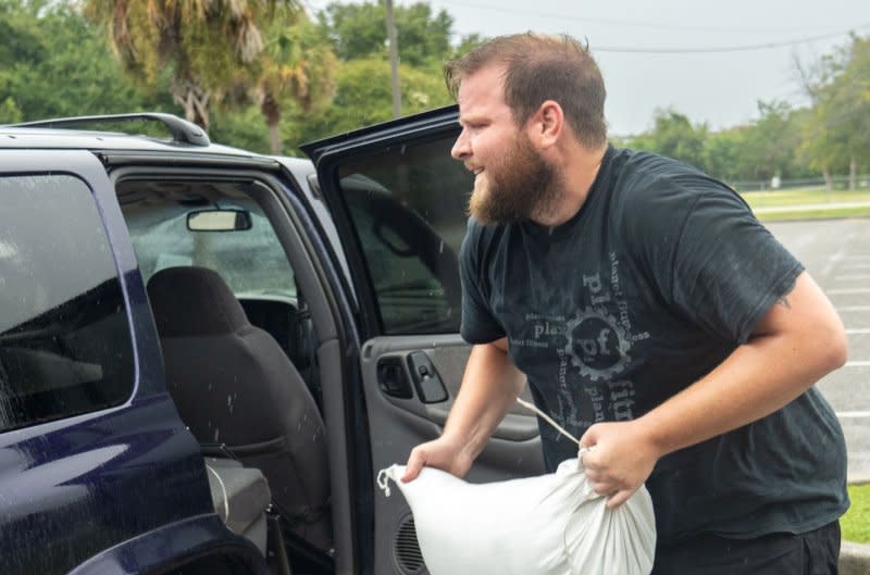 A resident loads sandbags into his vehicle in preparation for the arrival of Hurricane Idalia in Mount Pleasant, S.C., on Wednesday. Regions north of Florida were prepping for storm effects as the hurricane moves northward over the next few days. Photo by Richard Ellis/UPI