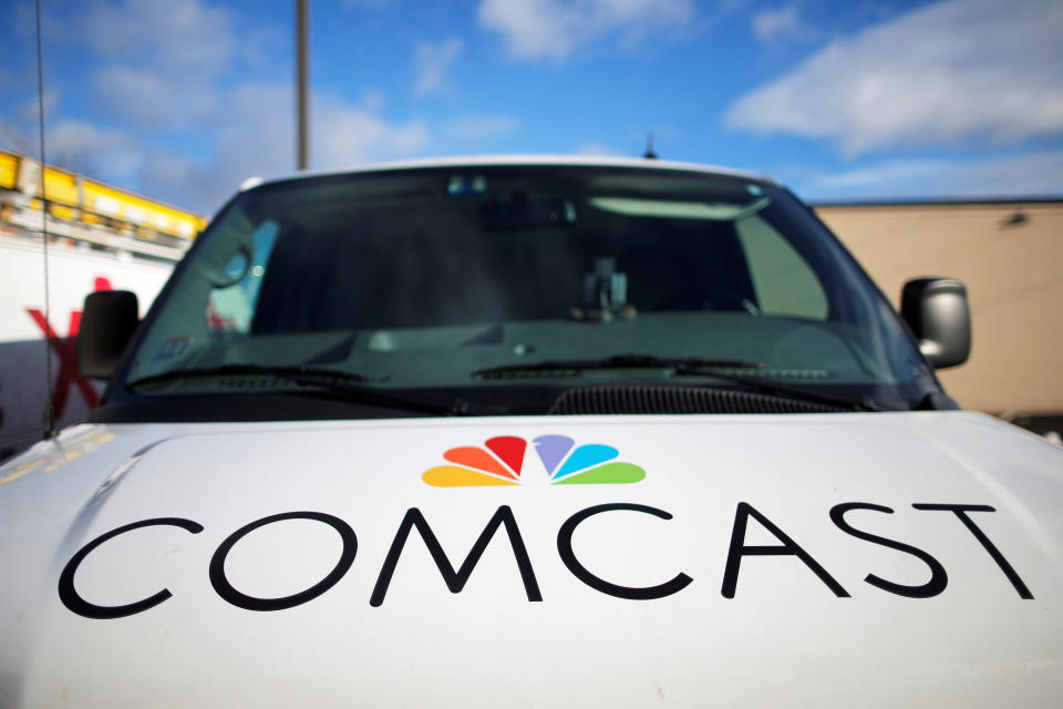 A technician's vehicle sits in the parking lot at a Comcast facility in Lawrence, Massachusetts, U.S. January 25, 2017.   REUTERS/Brian Snyder