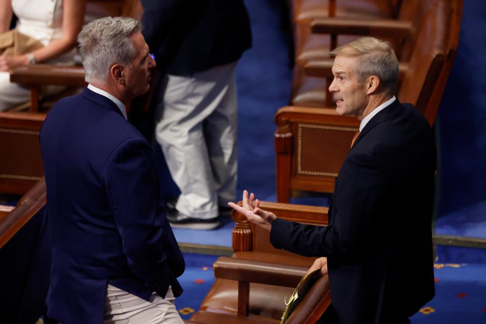 House Minority Leader Kevin McCarthy, R-Calif., left, talks with Rep. Jim Jordan, R-Ohio,  during the vote for the Bipartisan Safer Communities Act in the House Chamber on Friday in Washington. The congressmen voted against the legislation, the first new gun regulations passed by Congress in more than 30 years, passed by a vote of 234-193.