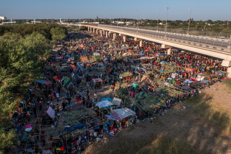 Migrants await to be processed