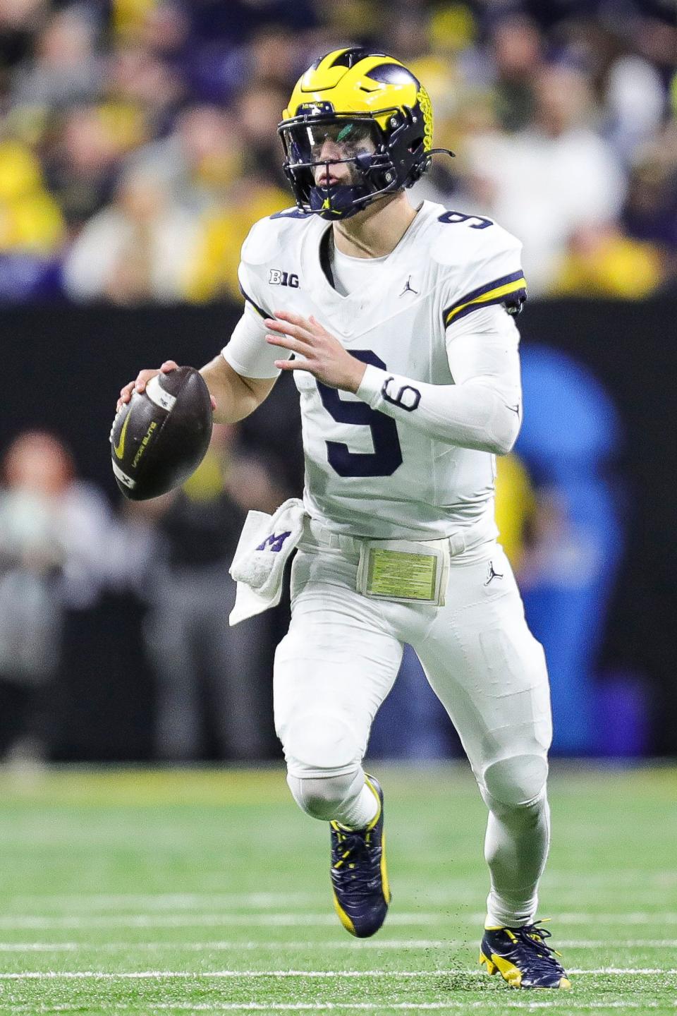 Michigan quarterback J.J. McCarthy looks to pass against Iowa during the second half of U-M's 26-0 win over Iowa in the Big Ten championship game in Indianapolis on Saturday, Dec. 2, 2023.