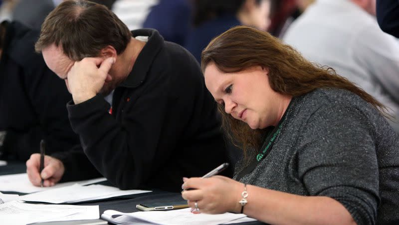 Mindy Sipes fills out an application for expungement on “Expungement Day” at St. Vincent de Paul Dining Hall in Salt Lake City on April 5, 2018.