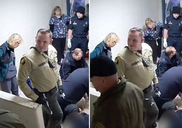 The officer turns his back to Mr Holland and smirks other deputies. Source: The Tribune