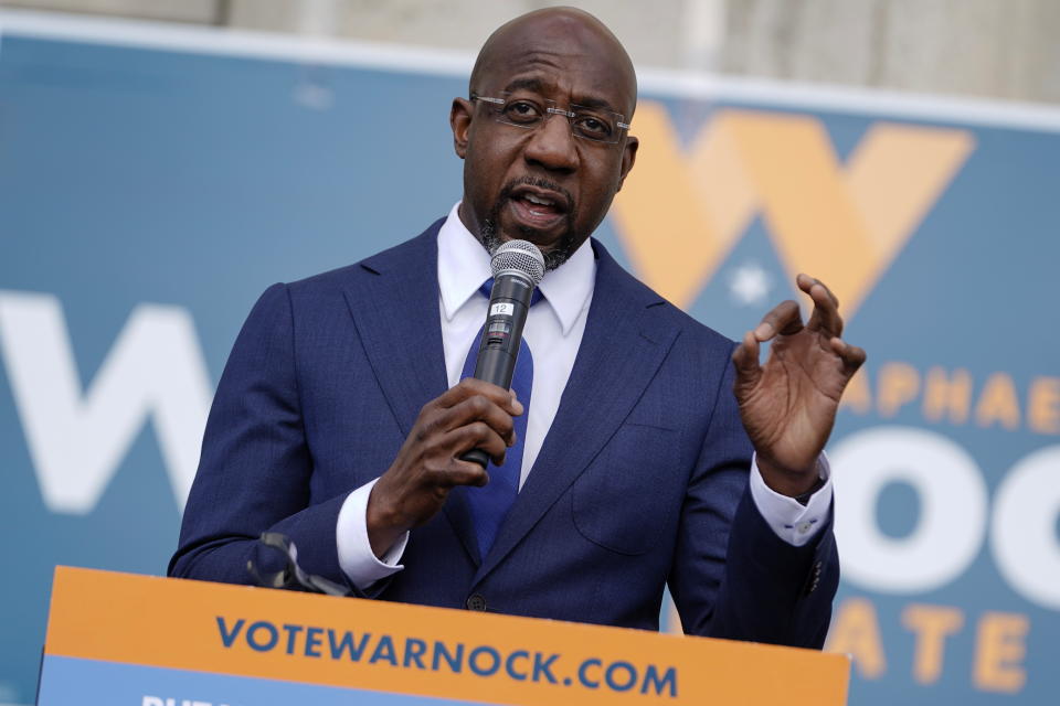 Democratic U.S. Senate candidate Raphael Warnock speaks to labor organizers and the media outside a labor union's offices in Atlanta, Georgia, U.S. January 5, 2021.  REUTERS/Elijah Nouvelage