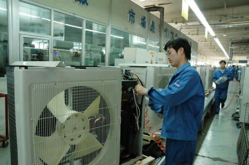 Workers make appliances at the Haier factory in Qingdao, in northeast China's Shandong province in June 2012. Chinese appliance and electronics giant Haier is aiming to expand into Europe with higher-end products, helping to upgrade China's reputation for churning out mostly cheap, low-quality goods