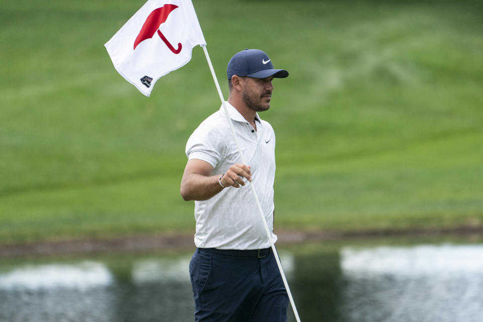 Brooks Koepka walks along the eighth green after putting during the pro-am ahead of the Travelers Championship golf tournament at TPC River Highlands, Wednesday, June 23, 2021, in Cromwell, Conn. (AP Photo/John Minchillo)
