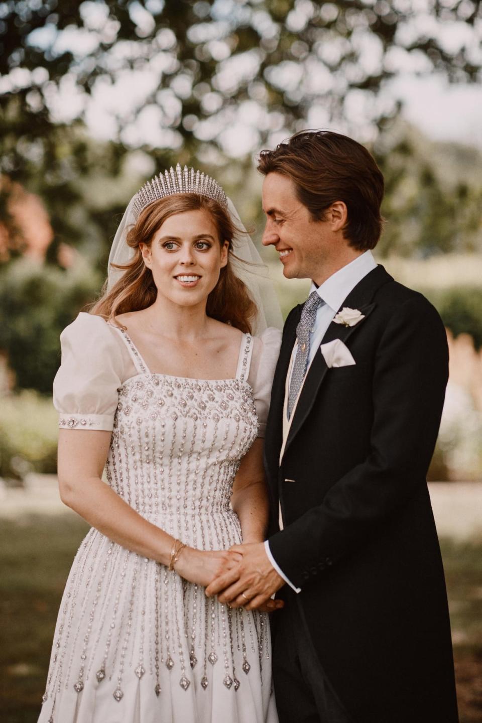 <div class="inline-image__caption"><p>Britain's Princess Beatrice and Edoardo Mapelli Mozzi are seen in the grounds of the Royal Lodge after their wedding, in Windsor, Britain, in this official wedding photograph released by the Royal Communications on July 19, 2020.</p></div> <div class="inline-image__credit">Benjamin Wheeler/Pool via REUTERS</div>