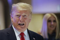 U.S. President Donald Trump and Ivanka Trump, right, arrive at the World Economic Forum in Davos, Switzerland, Wednesday, Jan. 22, 2020. The 50th annual meeting of the forum is taking place in Davos from Jan. 21 until Jan. 24, 2020. (AP Photo/Markus Schreiber)