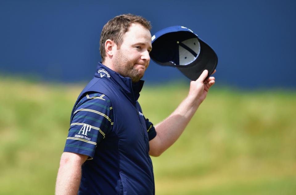 Branden Grace salutes the crowd after shooting a 62