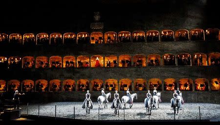 Horses and riders perform on stage during a dress rehearsal of Wolfgang Amadeus Mozart's cantata "Davide penitente" in Salzburg January 20, 2015. REUTERS/Dominic Ebenbichler