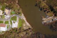 <p>An aerial view of an area that was reclaimed by a nearby mangrove during the passing of Hurricane Maria in Manati, Puerto Rico on Oct. 6, 2017. (Photo: Ricardo Arduengo/AFP/Getty Images) </p>