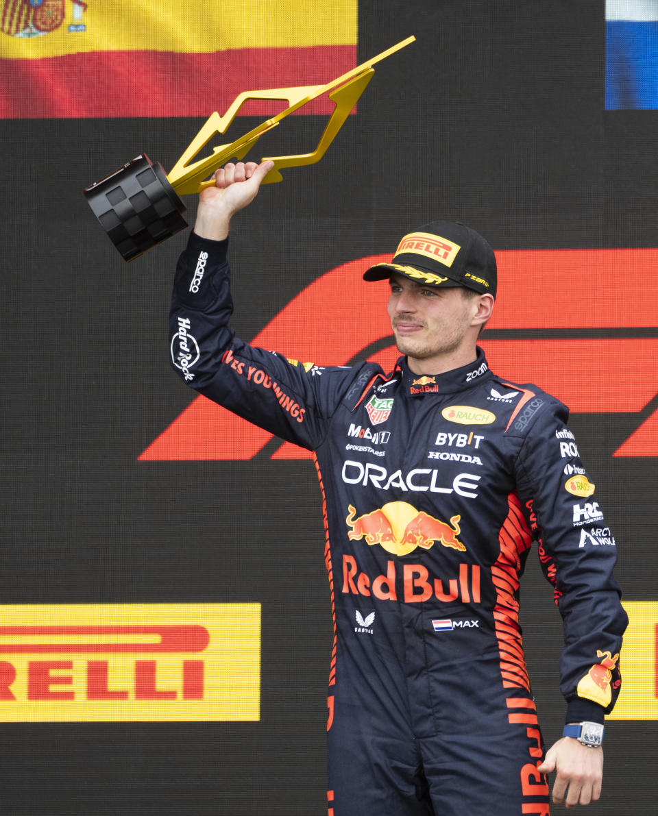 Red Bull Racing's Max Verstappen, of the Netherlands, celebrates his win on the podium following the Formula One Canadian Grand Prix auto race, Sunday, July 18, 2023, in Montreal. (Paul Chiasson/The Canadian Press via AP)