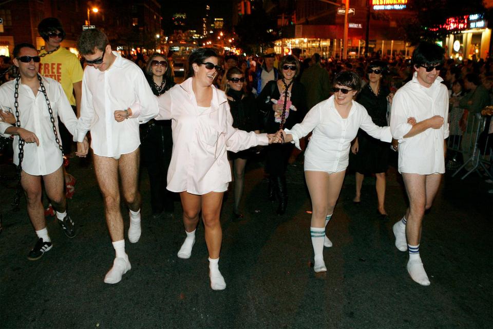 A Risky Business Halloween costume involving people in a white button down shirt, boxers, and socks