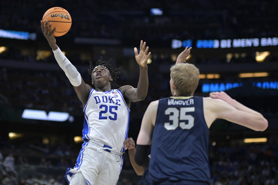 Duke forward Mark Mitchell (25) goes up to shoot in front of Oral Roberts forward Connor Vanover (35) during the second half of a first-round college basketball game in the NCAA Tournament, Thursday, March 16, 2023, in Orlando, Fla. (AP Photo/Phelan M. Ebenhack)