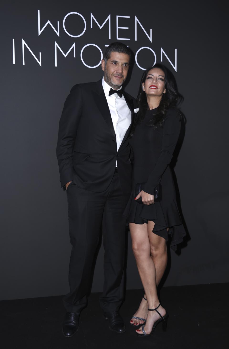 FILE - Nabil Ayouch, left, and Maryam Touzani pose for photographers upon arrival at the Kering Women In Motion Awards during the 76th international film festival, Cannes, southern France, Sunday, May 21, 2023. Ayouch, Touzani’s husband who co-wrote “The Blue Caftan” with her and is its main producer, said he is curious about moviegoers’ reactions. “There’s a younger and younger audience and they want to see new type of movies, new type of cinemas in the Arab world,” he said. “The more conservative audience will probably not be very pleased.” Part of art’s role, Ayouch said, is to disturb, to stir debate. (Photo by Vianney Le Caer/Invision/AP, File)