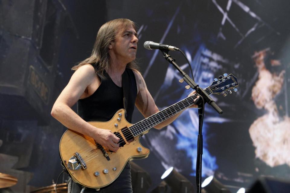 Malcolm Young performing on stage with AC/DC (Getty)