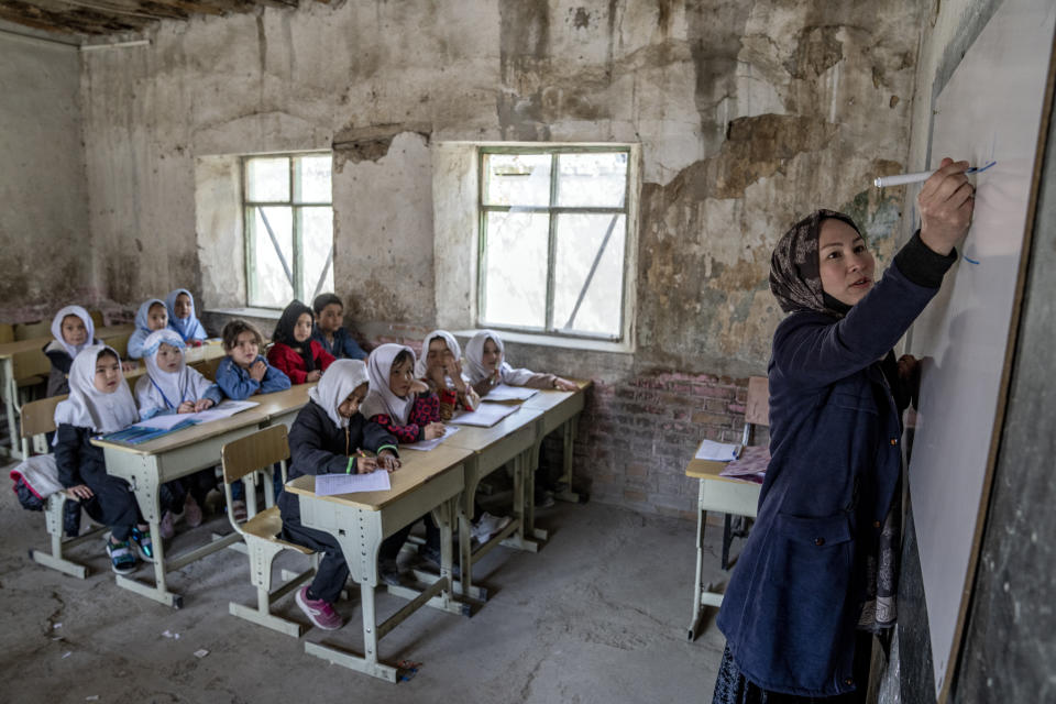 FILE - A teacher leads a girl's class on the first day of the school year, in Kabul, Afghanistan, on Saturday, March 25, 2023. (AP Photo/Ebrahim Noroozi, File)