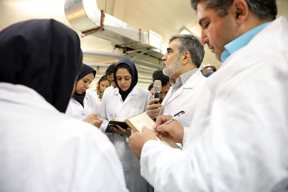 In this photo released by the Atomic Energy Organization of Iran, spokesman of the organization Behrouz Kamalvandi, center, briefs the media while visiting Fordo nuclear site near Qom, south of Tehran, Iran Saturday, Nov. 9, 2019. Joe Biden has an Iran problem. And, it’s getting more complicated by the day. Thanks to provocative moves by Iran and less-than-coherent actions by the outgoing Trump administration, the president-elect is facing an increasingly uncertain situation when it comes to Iran, a decades-long American nemesis that has been a target of blame for much of the Middle East's instability, (Atomic Energy Organization of Iran via AP)