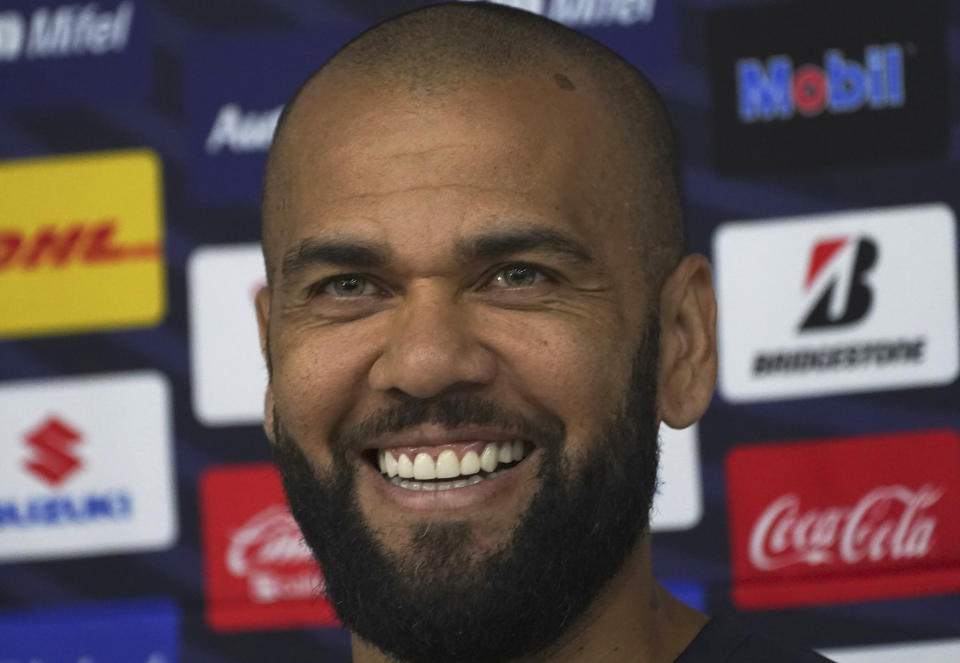 Brazilian Dani Alves smiles as he is presented to media as a new member of the Pumas UNAM, in Mexico City, Saturday, July 23, 2022. (AP Photo/Marco Ugarte)