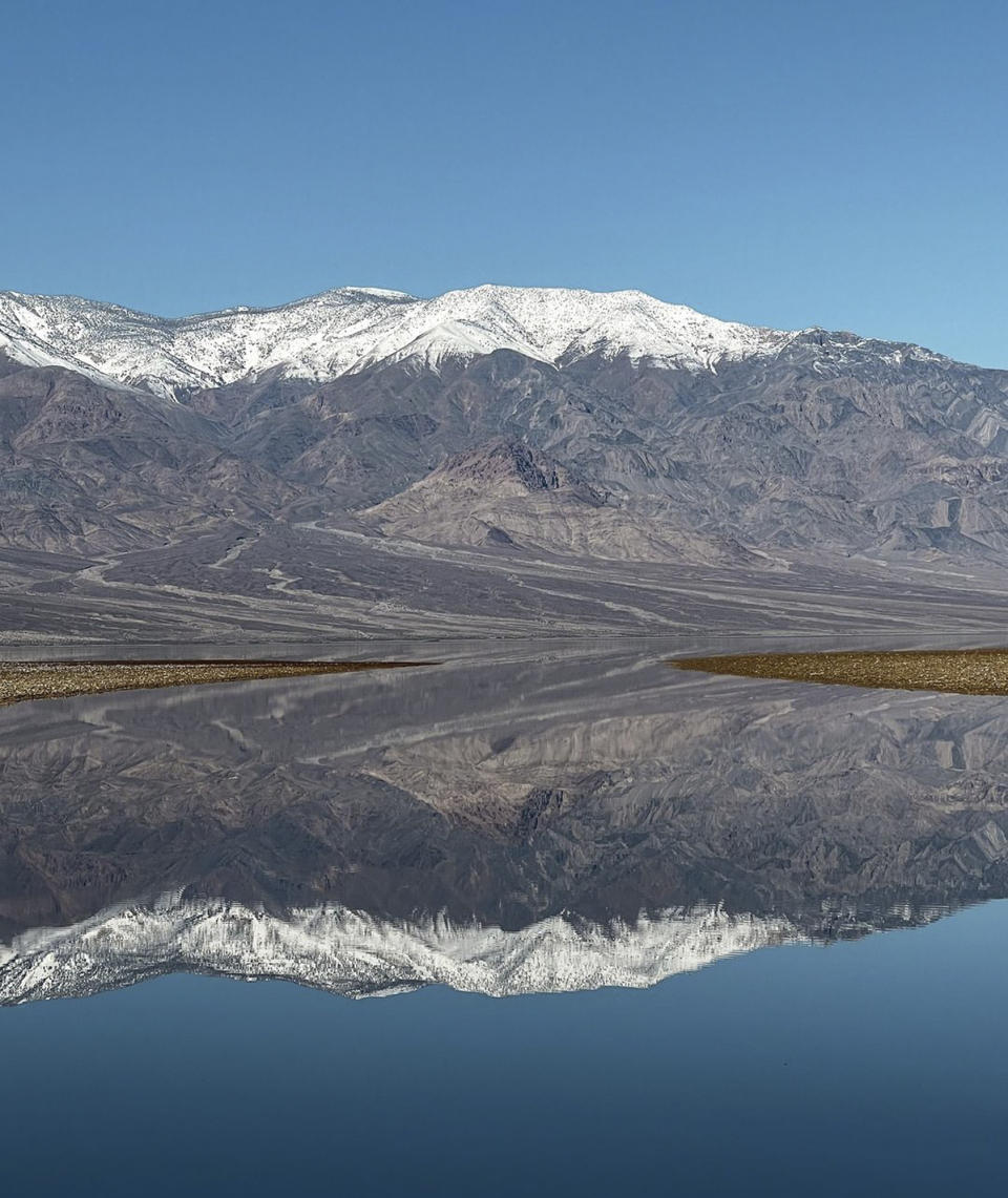 In this photo released by the National Park Service, is a lake created at Badwater Basin in Death Valley National Park, Calif., on Feb. 12, 2024. The lake was largely created by remnants of Hurricane Hilary in late August and a powerful atmospheric river early this month, according to the National Park Service. California's current rainy season got off to a slow start but has rebounded with recent storms that have covered mountains in snow and unleashed downpours, flooding and mudslides. (K. Skilling/National Park Service via AP)