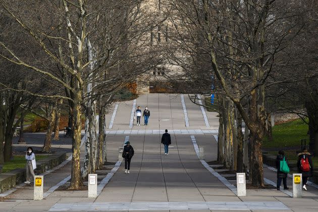 Students are seen walking at Cornell University in Ithaca, New York. The school announced that all classes will be canceled on Friday for a 