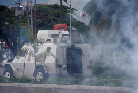 Riot security forces use tear gas during protest against Venezuelan President Nicolas Maduro's government in Valencia, Venezuela August 6, 2017. REUTERS/Andres Martinez Casares