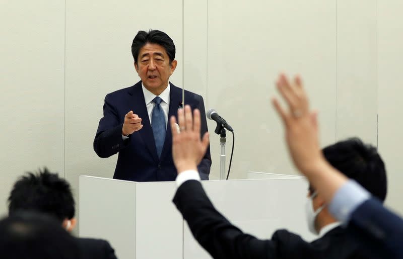 FILE PHOTO: Former Japanese PM Shinzo Abe holds a news conference in Tokyo