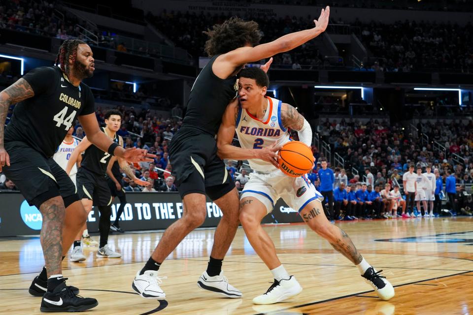 Then with Florida, Riley Kugel (2) drives the lane against Colorado on March 22, 2024 during the NCAA tournament in Indianapolis.