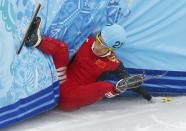 China's Liang Wenhao crashes out in the men's 500 metres short track speed skating final event at the Iceberg Skating Palace during the 2014 Sochi Winter Olympics February 21, 2014. REUTERS/Marko Djurica (RUSSIA - Tags: OLYMPICS SPORT SPEED SKATING)