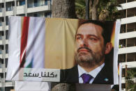 A poster depicting Lebanon's Prime Minister Saad al-Hariri, who has resigned from his post, is seen in Beirut, Lebanon, November 10, 2017. REUTERS/Aziz Taher